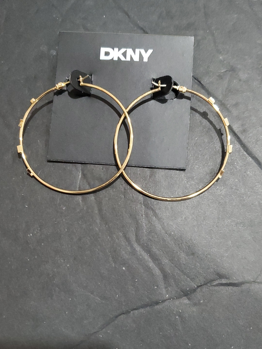 DKNY gold tone classic hoop earrings accented with DKNY monogram brand new